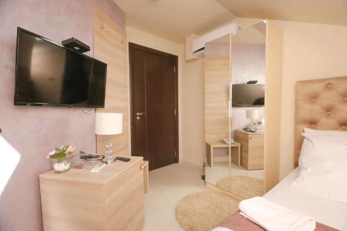 Habitación individual estándar | Cortinas opacas y sistema de insonorización