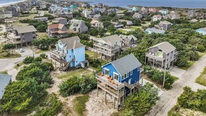 A coastal residential area with houses featuring balconies and waterfront views.
