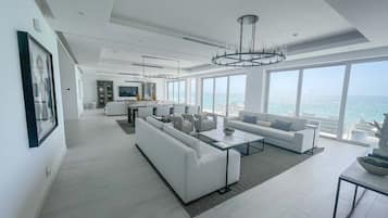 Luxury Condo | Living area | 65-inch Smart TV with cable channels, TV, Netflix