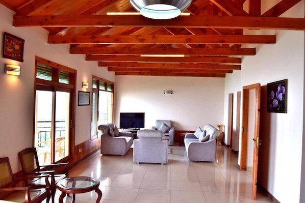 Standard Apartment | Living room | 32-inch LCD TV with cable channels, TV - Hilla Apartments Nathia Gali (Abbottabad)