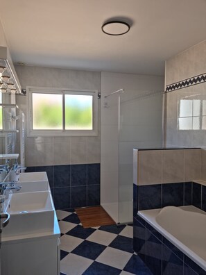 Bathtub, hair dryer, towels, soap