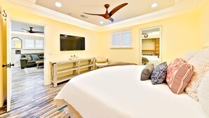 A bedroom with a large bed, a ceiling fan, a TV, and a walk-in closet. - 25% Off Sept WkDay, Near Wineries -Private Jacuzzi (Temecula)