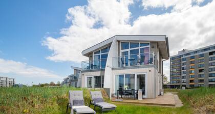 "Experience Coastal Bliss in Our Charming Ferienhaus Herzmuschel!"