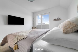 2 habitaciones, tabla de planchar con plancha y cuna de viaje