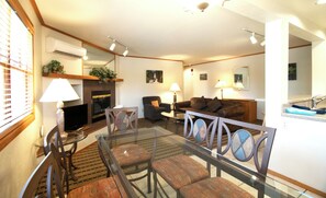 Deluxe Condo, 1 Bedroom, Non Smoking | Living area | 40-inch flat-screen TV with cable channels, TV, fireplace - Sunburst Condominiums (Steamboat Springs)