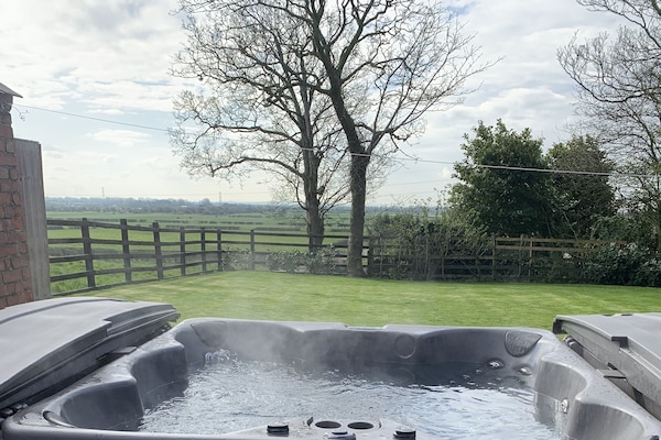 Bañera de hidromasaje al aire libre