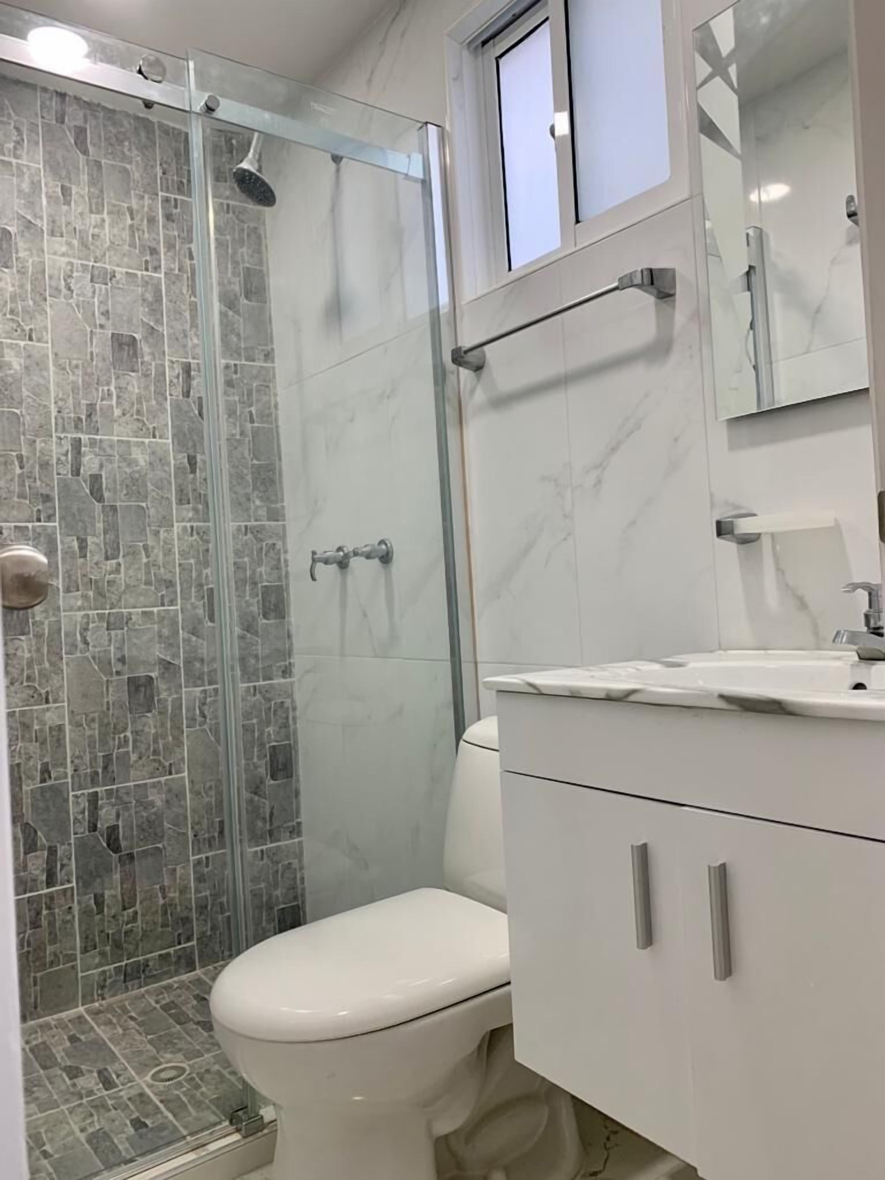 Family Apartment | Bathroom | Shower, rainfall showerhead, towels, toilet paper
