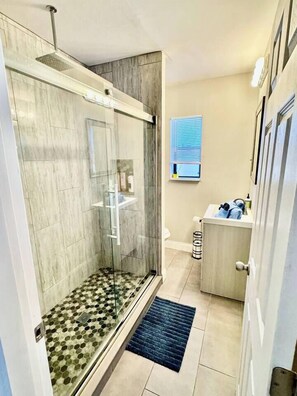Shower, hair dryer, towels, soap
