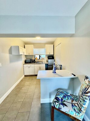 Fridge, microwave, stovetop, coffee/tea maker
