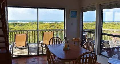 Condo with amazing porch overlooking the beach