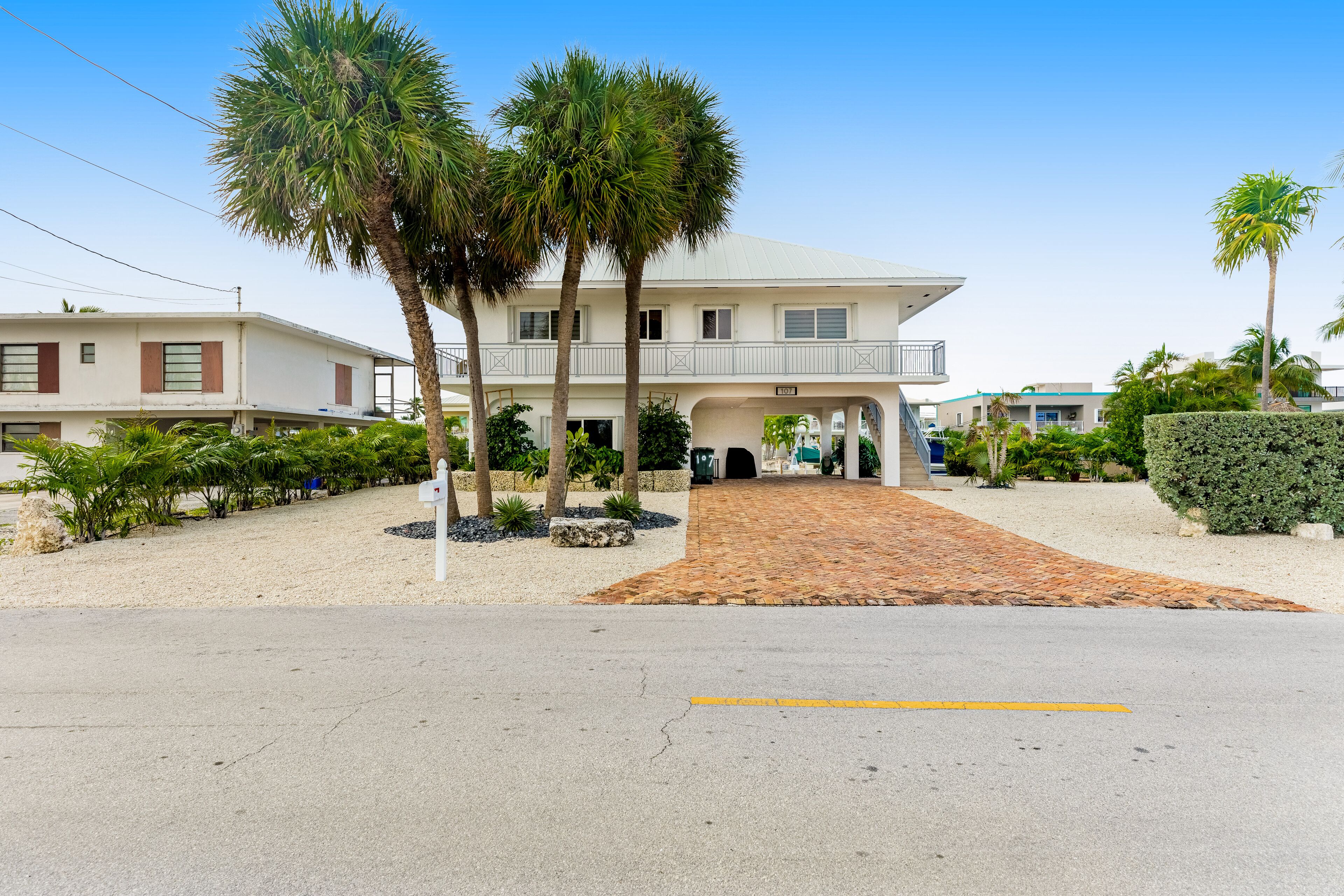 Canal-front home with private dock, wraparound deck, & central AC - snowbirds OK