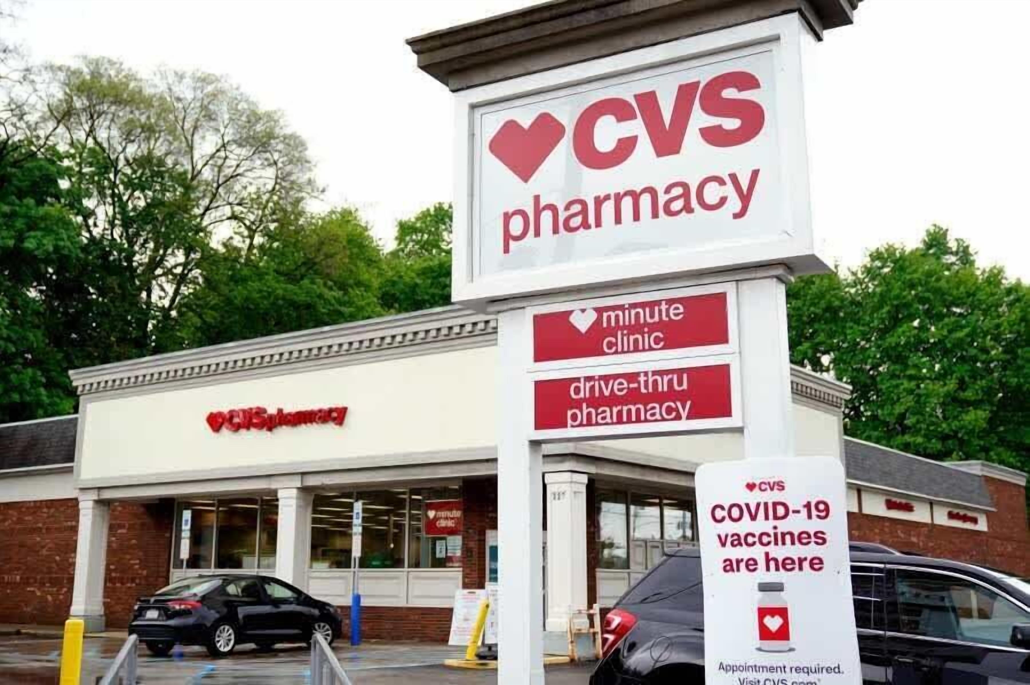 A CVS pharmacy with a sign indicating a minute clinic and drive-thru services.