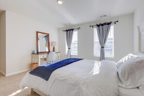 A bedroom with a bed, a dresser, a mirror, and two windows with curtains. - 3 Mi to Bethany Beach: 'The Chief’s Quarters' Home (Ocean View)