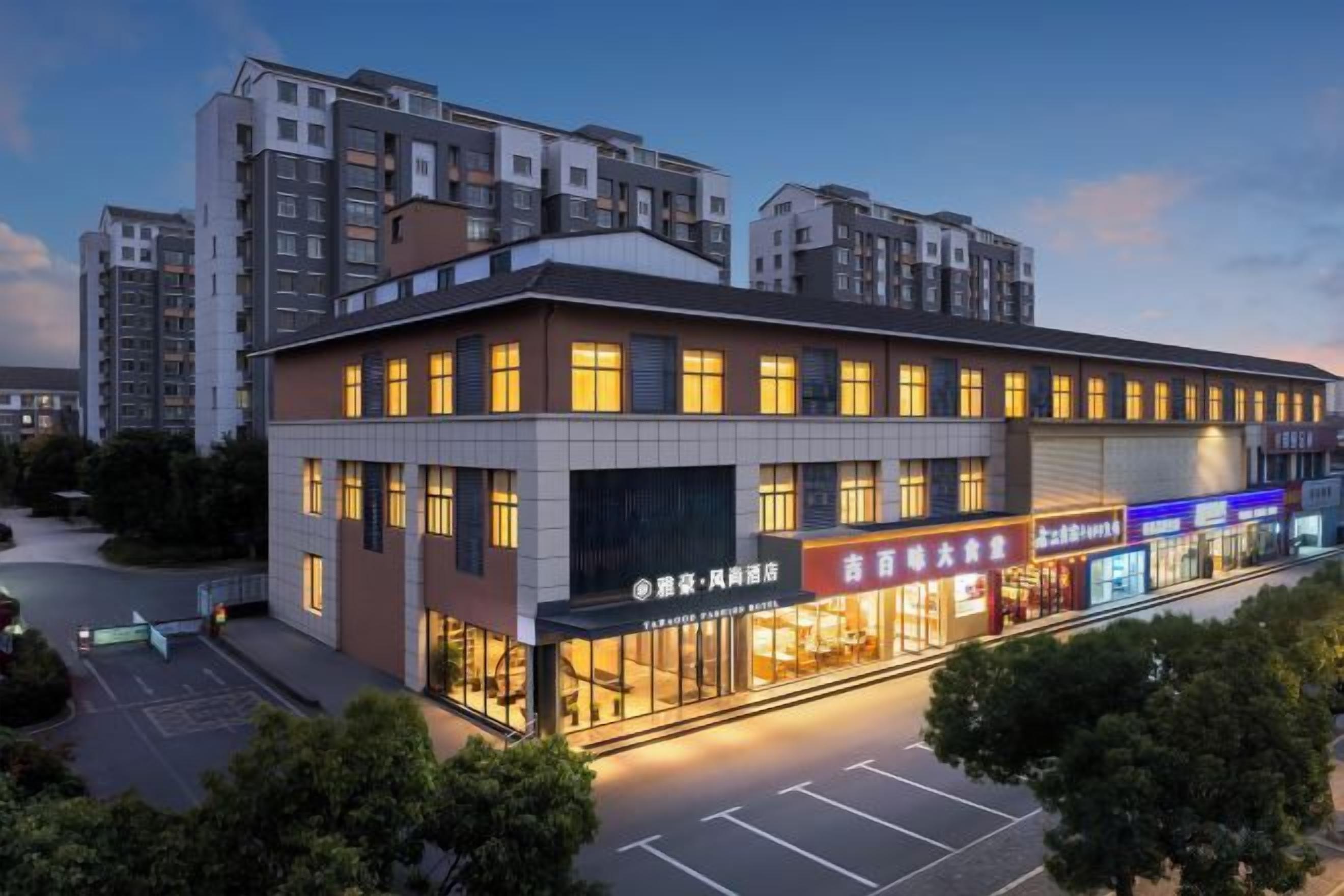 A multi-story building with a ground-level retail space and upper residential units.