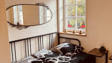 Desk, laptop workspace, free WiFi, bed sheets