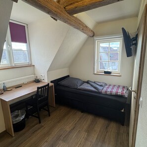 Desk, laptop workspace, free WiFi, bed sheets