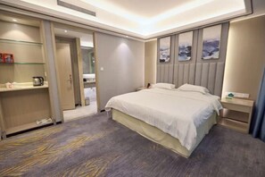 A hotel room with a bed, bedside tables, a wardrobe, and a bathroom visible through an open door. - New Haojing Hotel (Guangzhou Xintang Metro Station) (Guangzhou)