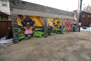 A building with a mural featuring cartoon characters.