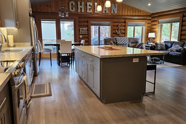 Walk into the house to an open space to the kitchen, living room, & dining area