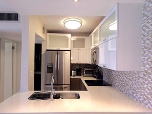 Fridge, microwave, stovetop, coffee/tea maker