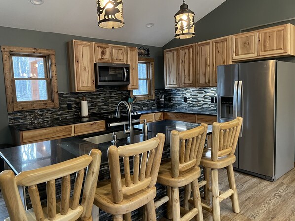 Fridge, microwave, oven, stovetop - Northern MI Log Cabin Inn–Hot Tub, Trails, Pools, Golf (Elmira)