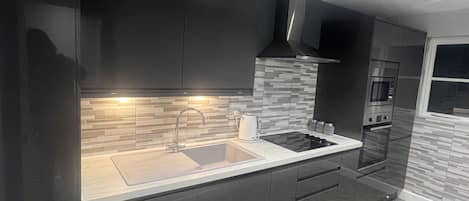 Apartment, 1 Queen Bed | Private kitchen | Fridge, microwave, oven, stovetop