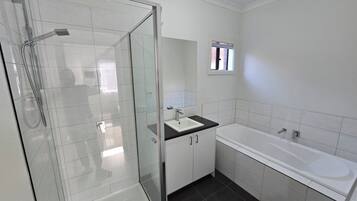 Shower, towels, shampoo, toilet paper