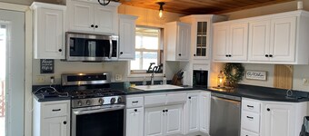 Cozy lakeside cabin retreat located on E. Rush lake. Great Fishing here!