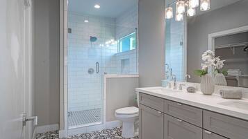 Shower, eco-friendly toiletries, hair dryer, towels