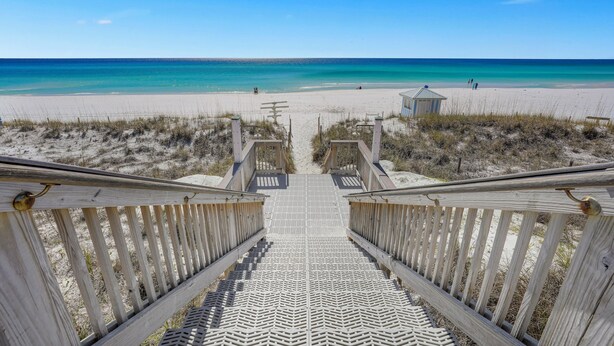 A wooden boardwalk leading to a beach with a clear view of the ocean. - The Crescent unit 110 2BR Condo w/ FREE Beach Service! (Miramar Beach)