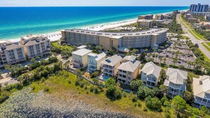 A coastal hotel with multiple buildings, a beach, and a clear view of the ocean. - The Crescent unit 110 2BR Condo w/ FREE Beach Service! (Miramar Beach)