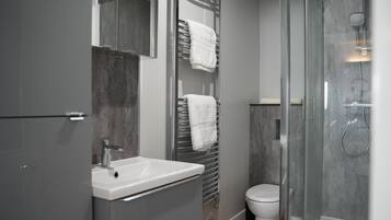 Shower, hair dryer, towels