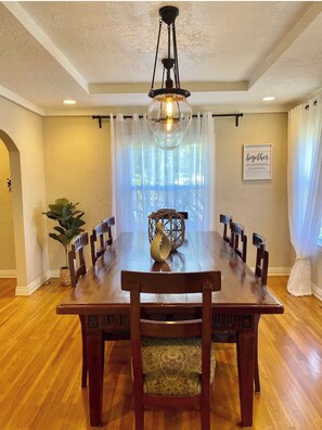 Enjoy meals together in a beautifully appointed dining room with a large table and comfortable seating.