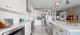 Tidal Walk home with pond views, outdoor pool, decks, fast WiFi, & bikes