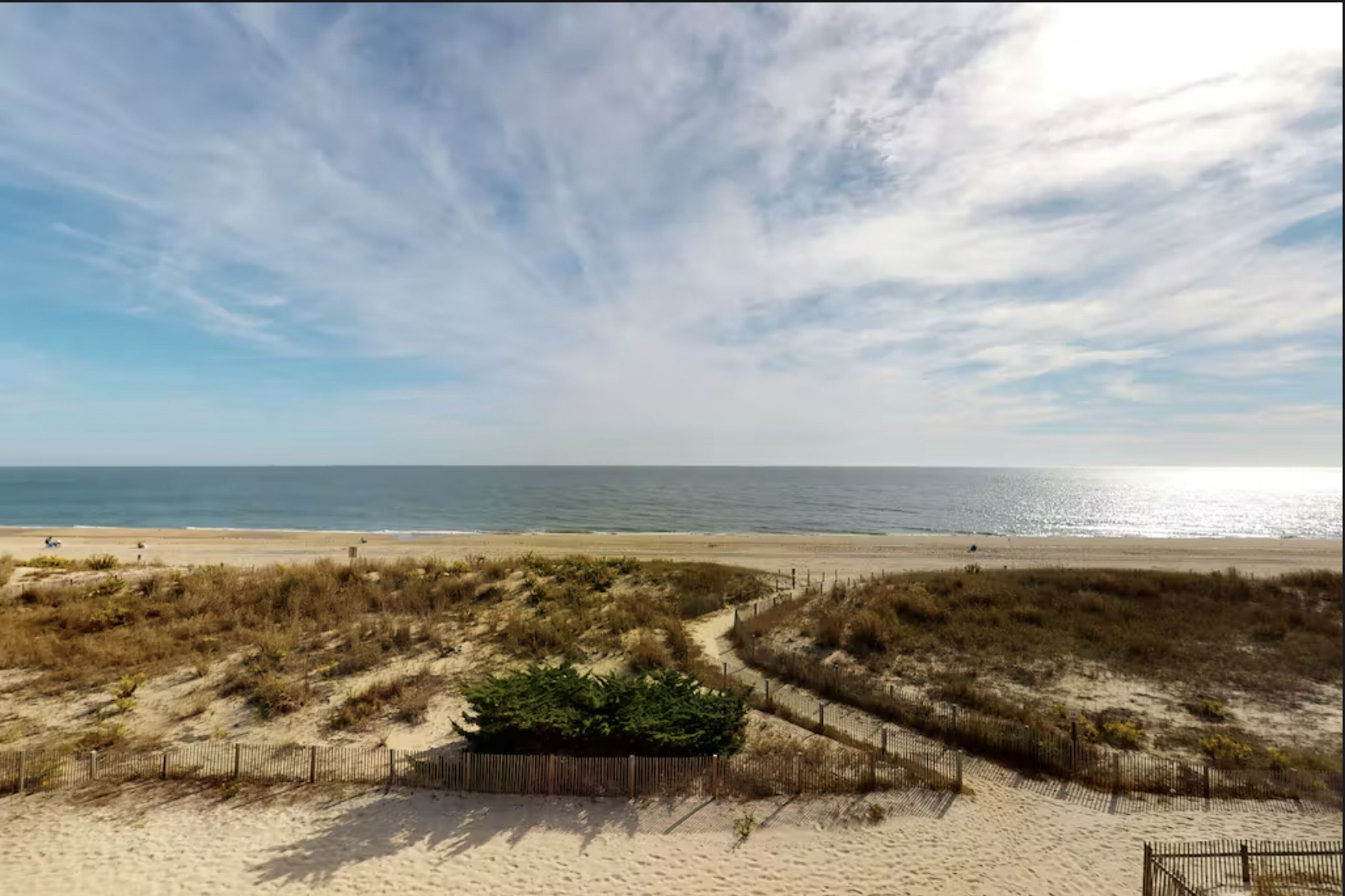 4-story beachfront townhome with ocean views, balconies, deck, outdoor shower