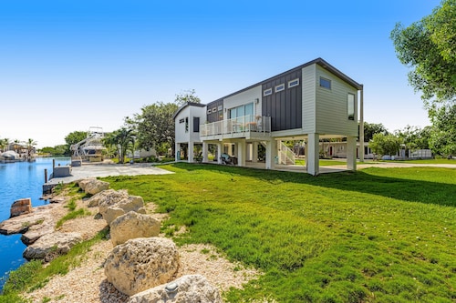 Beautiful waterfront home with central AC, dock, lovely balcony & patio