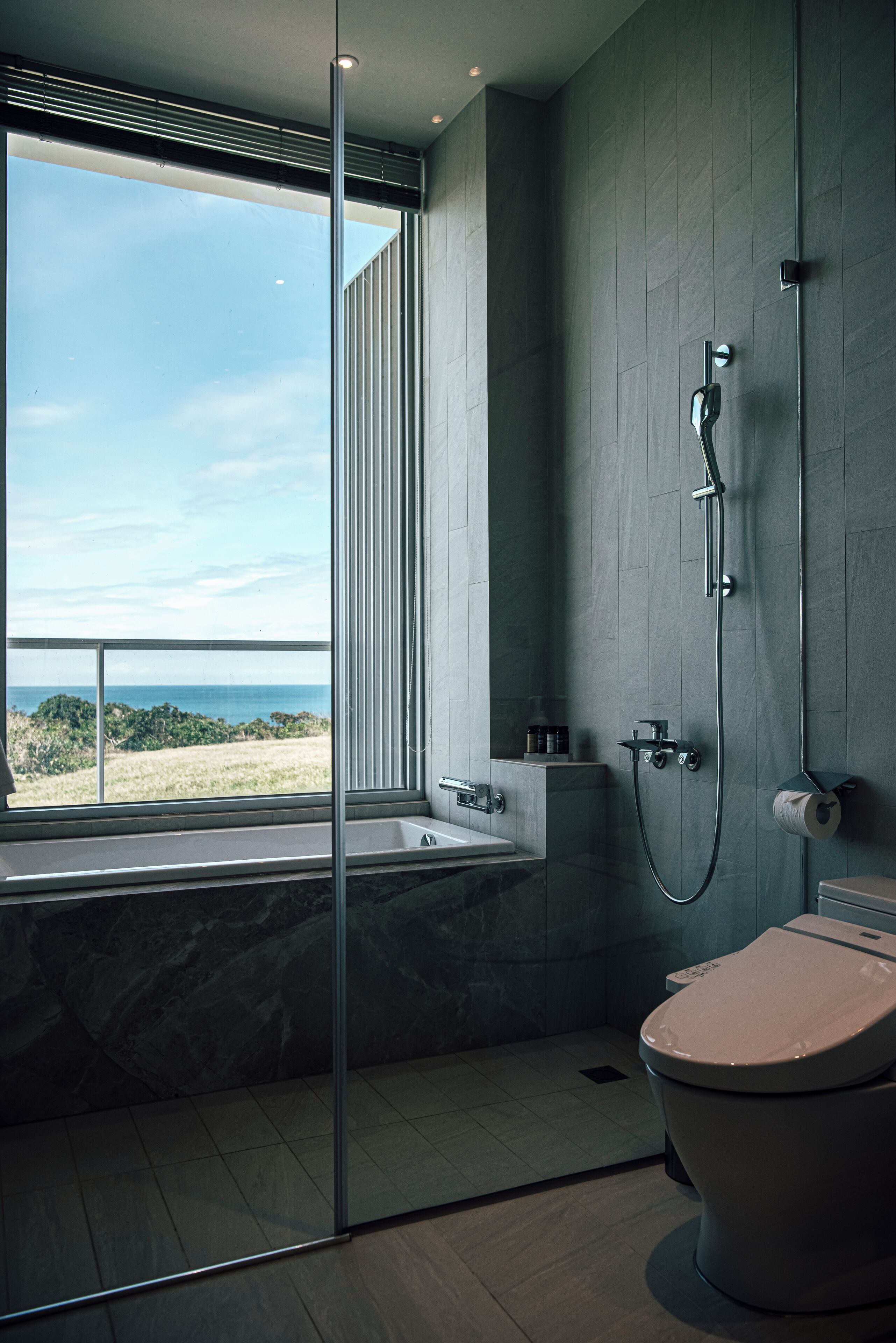 Separate bathtub and shower, hair dryer, slippers, towels