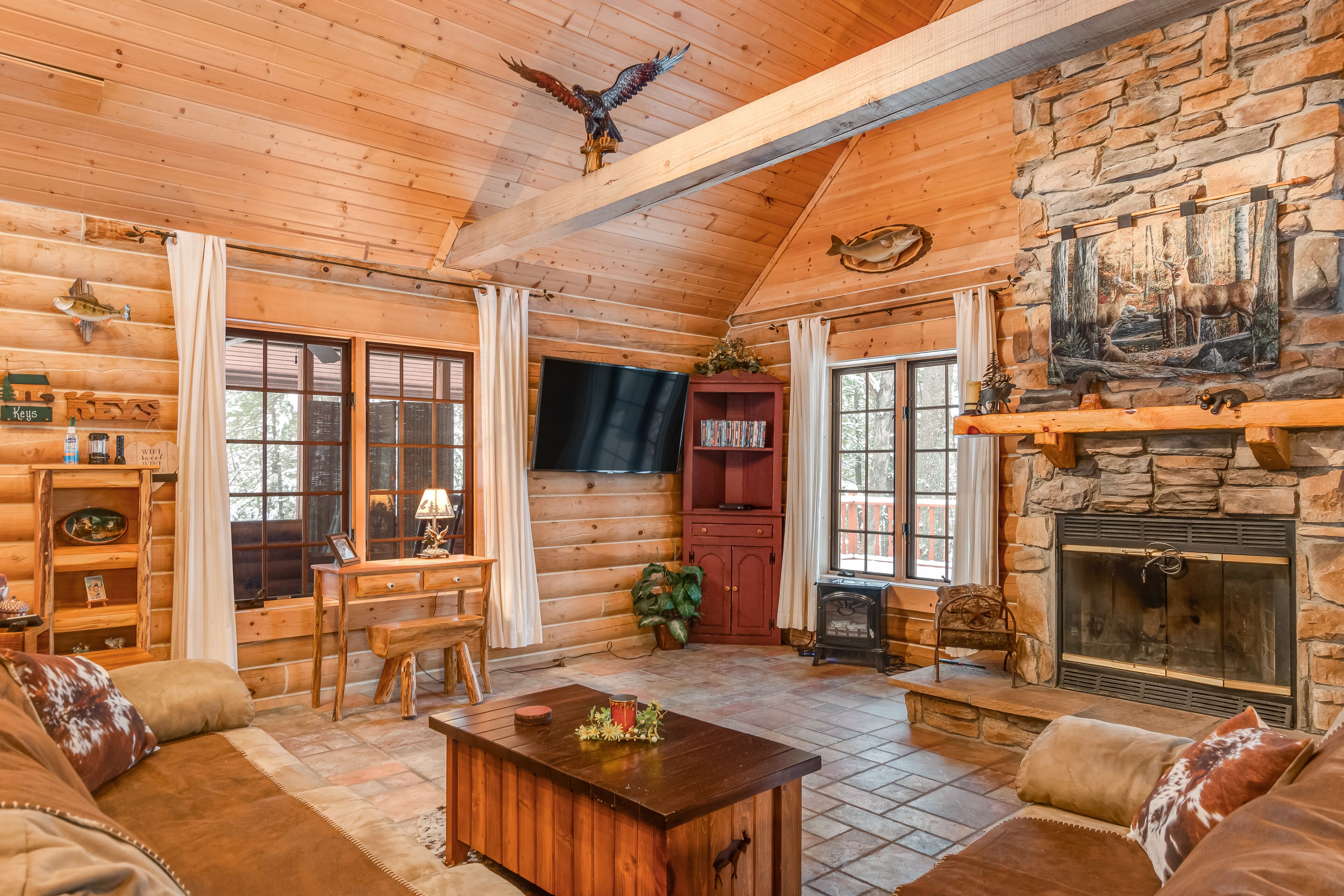 Dog-friendly cabin on the river with a large deck, firepit, grill & washer/dryer in Mauston, United States