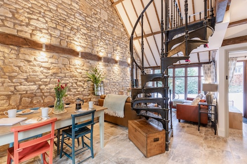 Stunning open plan 2 storey barn conversion with spiral staircase.