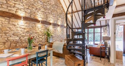 Stunning open plan 2 storey barn conversion with spiral staircase.