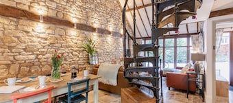 Stunning open plan 2 storey barn conversion with spiral staircase.