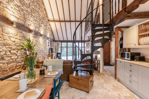 Stunning open plan 2 storey barn conversion with spiral staircase.