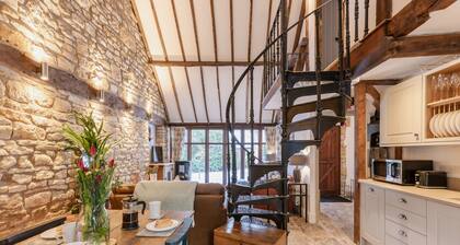 Stunning open plan 2 storey barn conversion with spiral staircase.