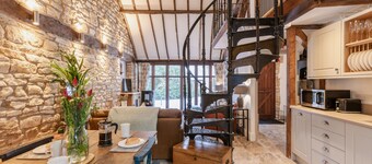 Stunning open plan 2 storey barn conversion with spiral staircase.