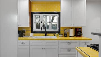 Fridge, microwave, stovetop, coffee/tea maker