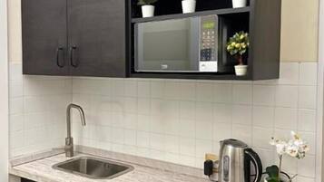 Full-sized fridge, espresso maker, electric kettle, toaster