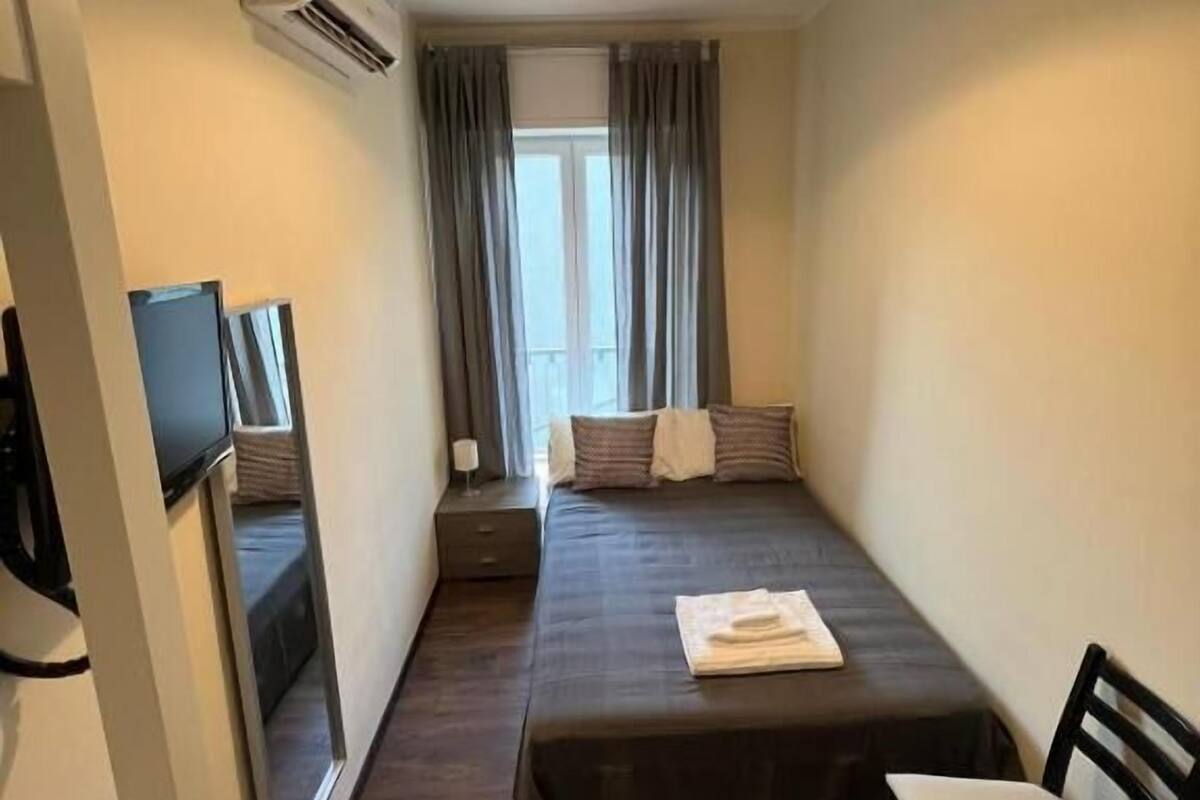 Room, 1 Large Twin Bed, Shared Bathroom | Desk, laptop workspace, WiFi (free), bed sheets