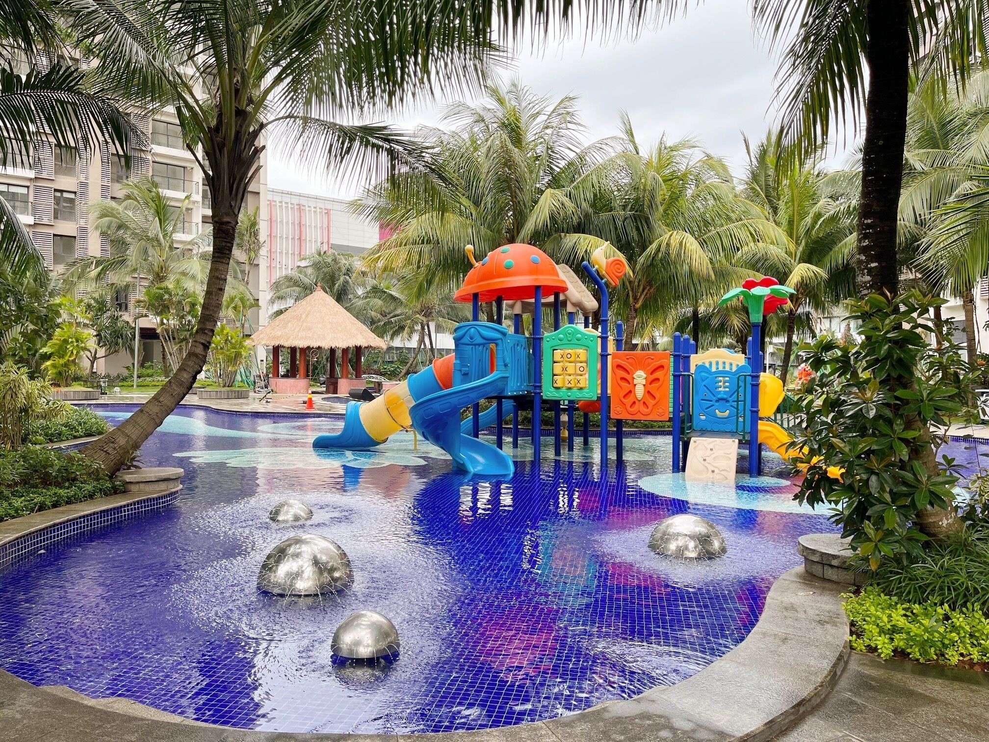 A water play area with slides and a pool.