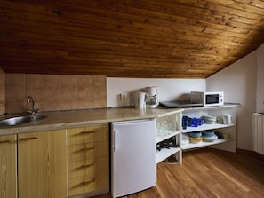 Fridge, microwave, cookware/dishes/utensils