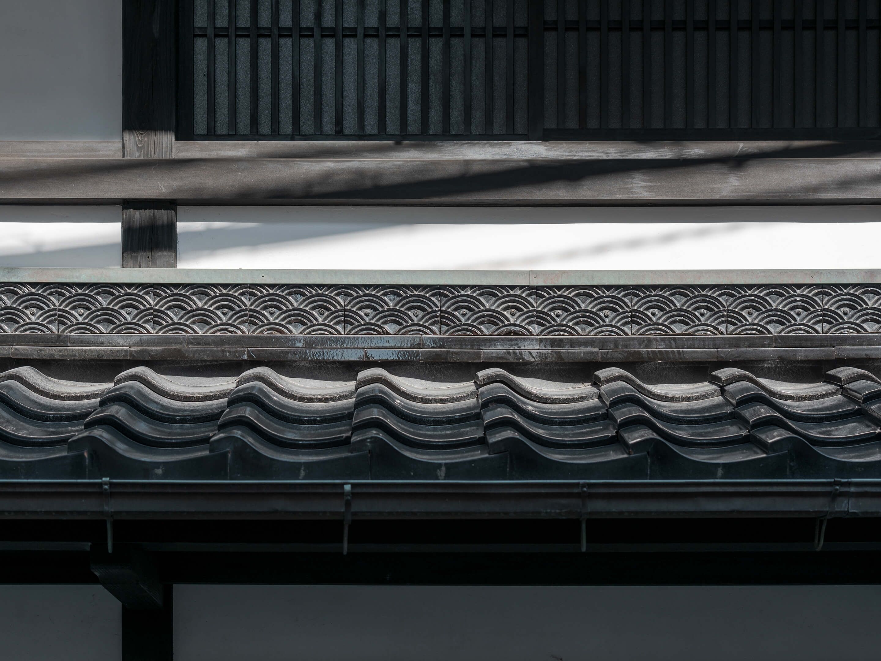 A traditional tiled roof with a decorative pattern.